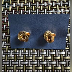 Gold tone knot twisted pierced earrings